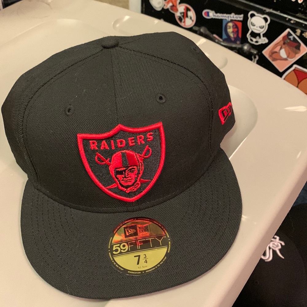 Red and black raiders hat